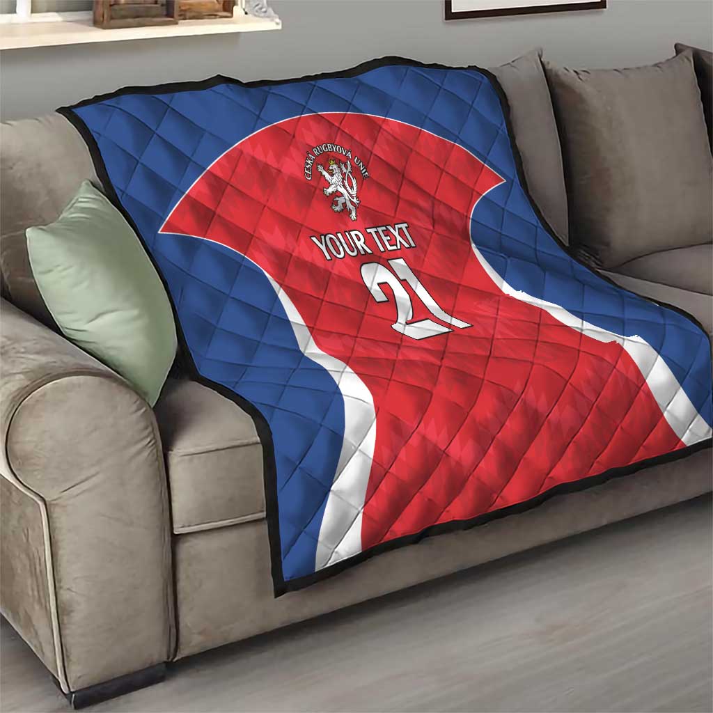 Rugby quilt on a sofa with blue backing and red jersey, lion crest, “YOUR TEXT” 21