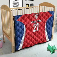 Quilted rugby blanket for a crib with blue border, red jersey, lion crest, “YOUR TEXT” 21