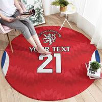 Red round carpet with rugby crest above 'YOUR TEXT 21' and blue side stripes