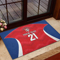 Red rugby doormat with blue-white border, lion crest, YOUR TEXT 21, corner view