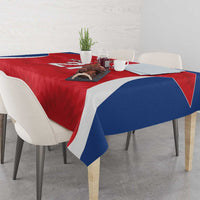 Red rugby tablecloth with blue-and-white diagonal panels and overhanging corners