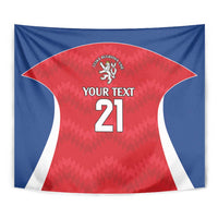 Rugby tapestry close-up, red jersey center with lion crest and 'Your Text 21' on blue border.