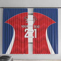 Rugby jersey-style window curtain panels in red and blue with lion crest and number 21