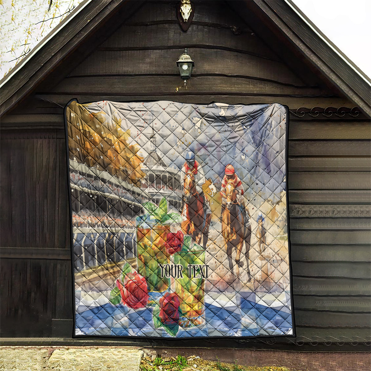 Beige quilt hung indoors with jockey and horse race scene, roses, and 'YOUR TEXT'.