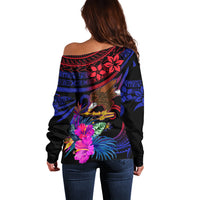 Women's off-shoulder sweater, back view, gradient blue floral and tribal motifs.