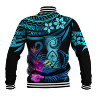 Back of blue and black baseball jacket with striped hem and large tropical print