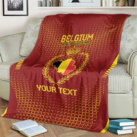 Red Belgium football blanket on a bed, gold crest and 'YOUR TEXT' lettering