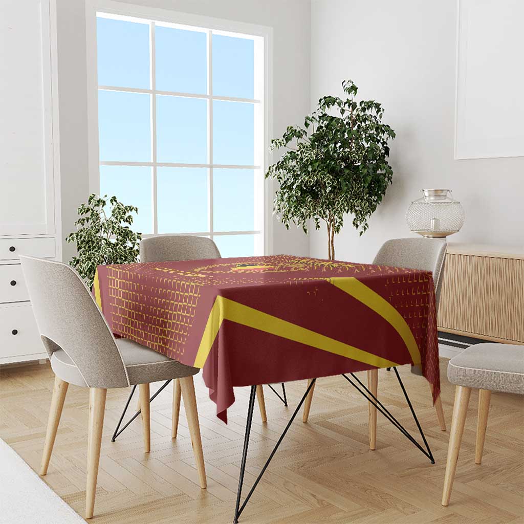 Red custom tablecloth with yellow stripe design on dining table with chairs