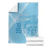Light blue football blanket folded with custom text, Belgium print, and 95 numerals