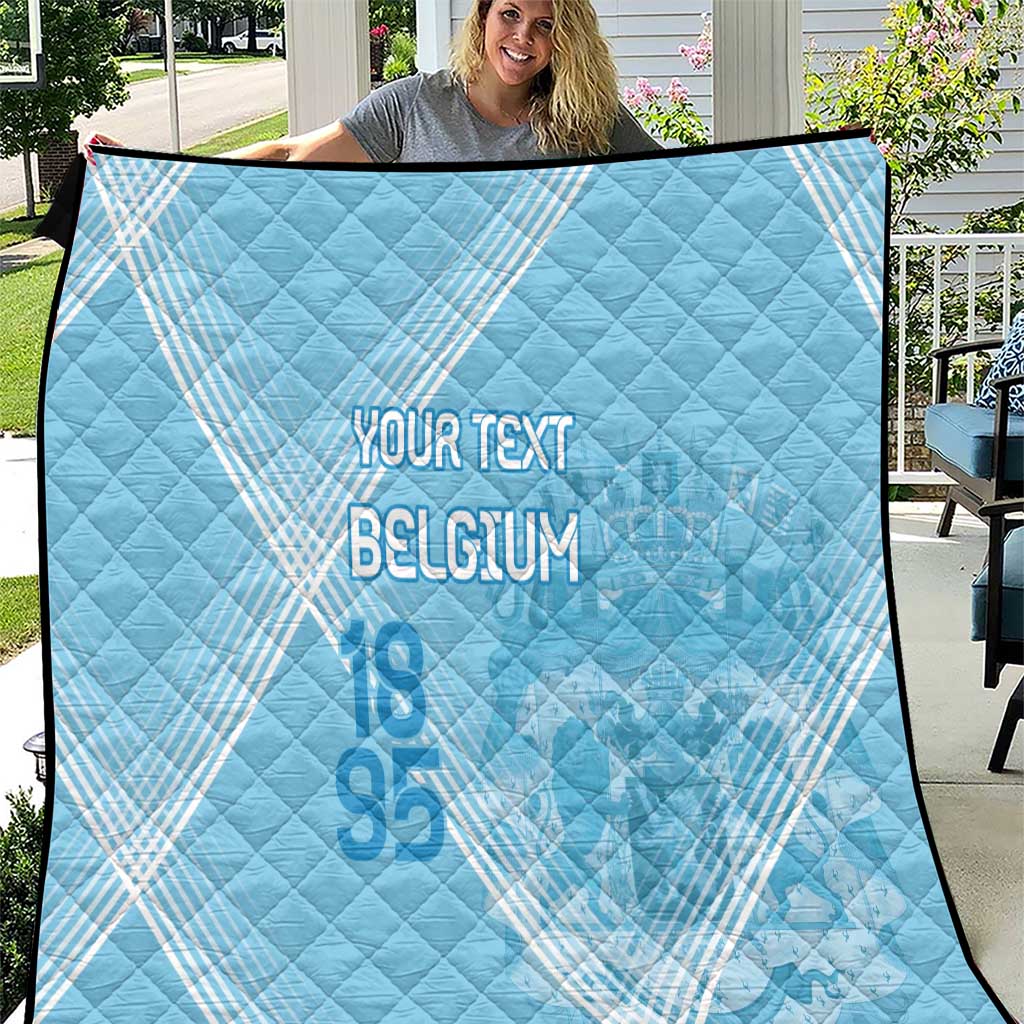 Light blue Belgium football quilt with diamond quilting and “BELGIUM” text, close view