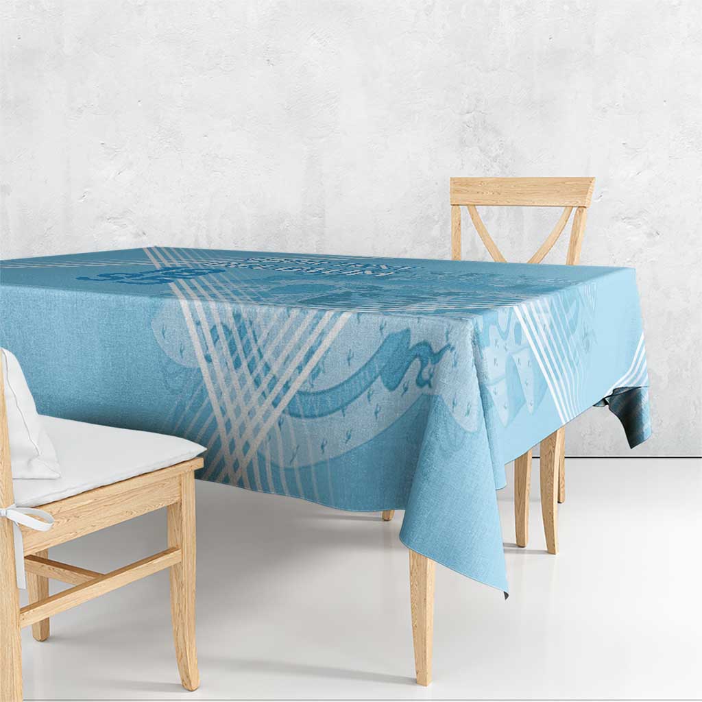 Blue football tablecloth draped over oval table, with diagonal lines and icons