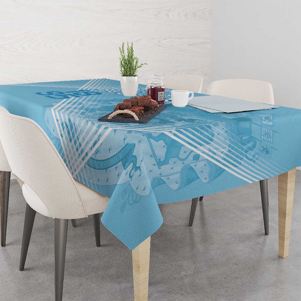 Blue football tablecloth on dining table with abstract football-themed map graphics