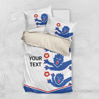 White duvet and pillowcases featuring blue lion print with red accents and 'YOUR TEXT'