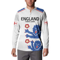 White sweatshirt with ENGLAND THREE LIONS, blue lion graphic, red flower accents on model