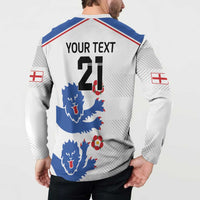 White sweatshirt with button placket, blue lion print, red/blue trim, 'YOUR TEXT 21' on model