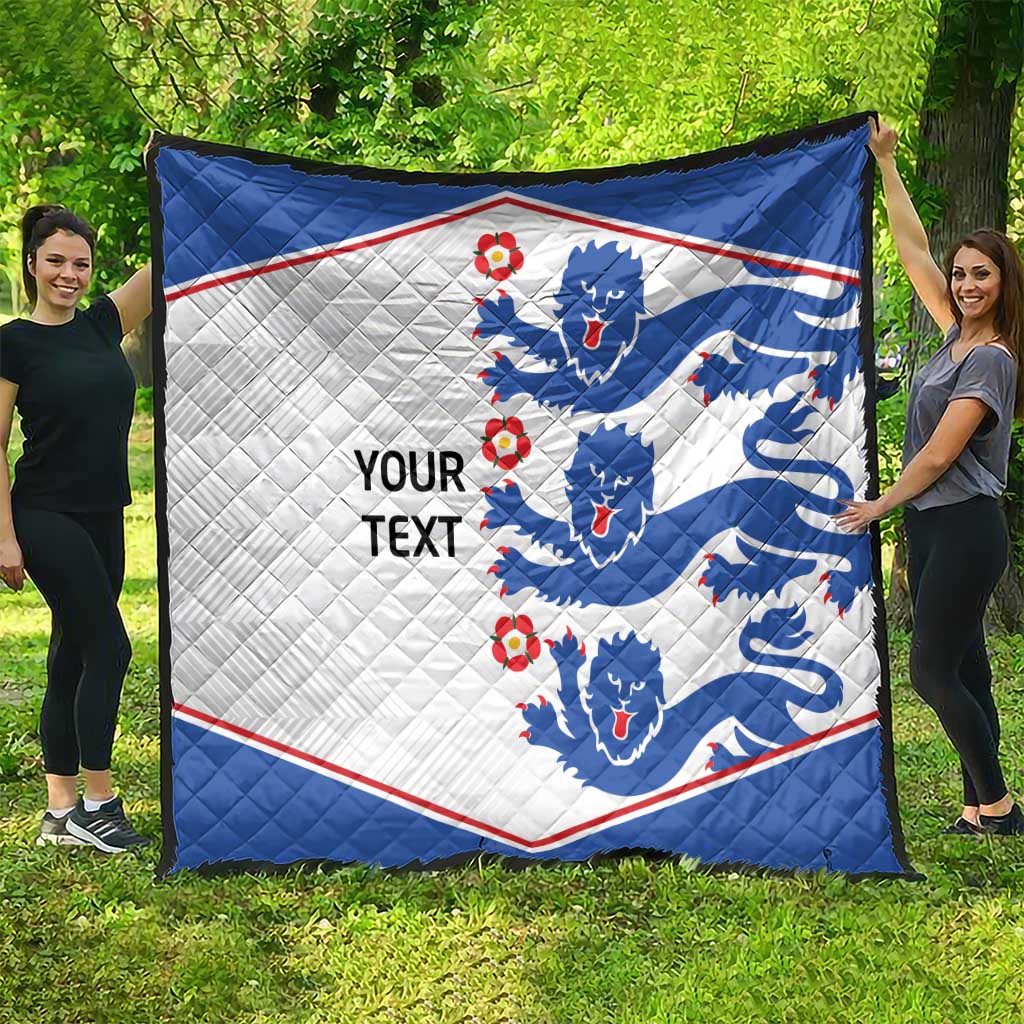 Blue and white quilt blanket with lion crests, red trim, and 'YOUR TEXT' text
