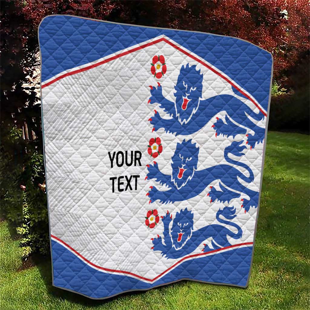 Blue and white quilt blanket with lion crests, red edge trim, and 'YOUR TEXT' wording