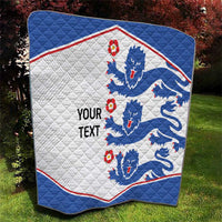 Blue and white quilt blanket with lion crests, red edge trim, and 'YOUR TEXT' wording