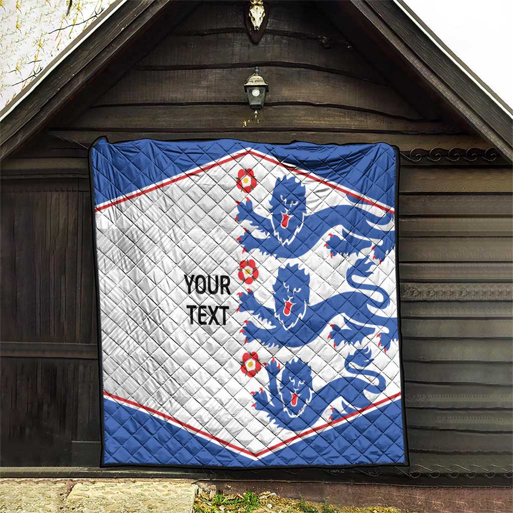 Blue and white quilt with lion pattern, red border, and 'YOUR TEXT' wording