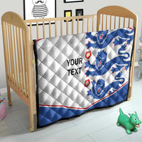 Blue and white quilt blanket with lion crests, red edge trim, and 'YOUR TEXT' text