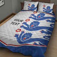 White and blue quilt bed set with lion crest pattern and red flower details; two square pillows