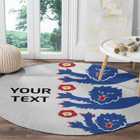 Round football rug with blue lion crests, red accents, and “YOUR TEXT” on light gray