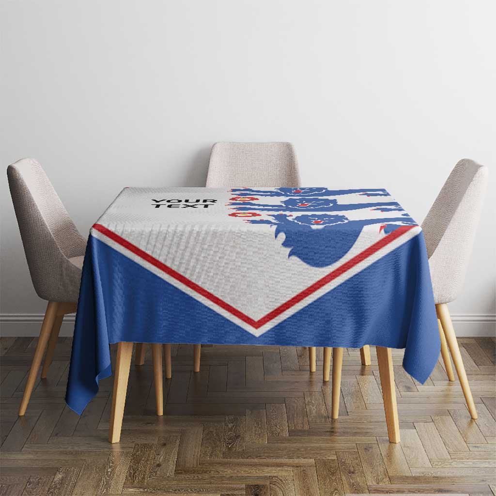 Custom text football tablecloth with blue lion pattern and red/white V border on table.