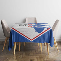 Custom text football tablecloth with blue lion pattern and red/white V border on table.