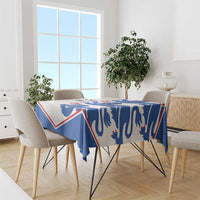 Football tablecloth with blue lion pattern and red/white border, draped on dining table.