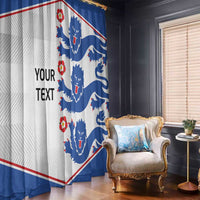 Window curtain panel with blue lion crest print and diagonal red and white border