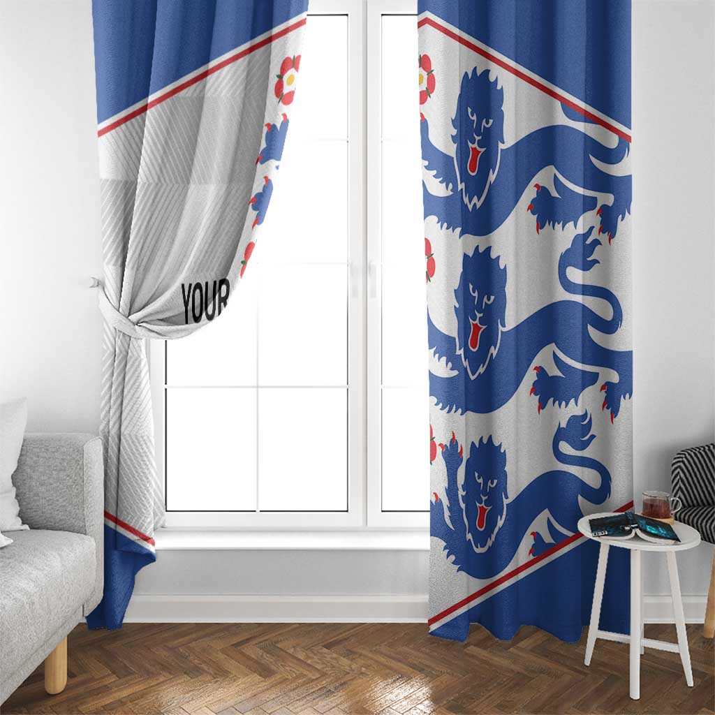Side view of blue and white window curtains with lion emblem print and red diagonal trim