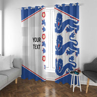Blue and white window curtains with lion emblem print and diagonal red accent lines