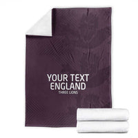 Purple football blanket with 'YOUR TEXT ENGLAND' text, with white folded towels