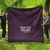 Purple football-style quilt with diamond stitch, spread wide, 'YOUR TEXT ENGLAND' text