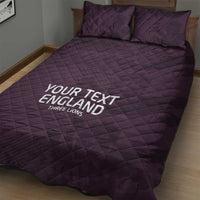 Purple quilt bed set with two pillows, diamond pattern, 'YOUR TEXT ENGLAND' on blanket