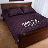 Purple quilt bed set with two pillows, 'YOUR TEXT ENGLAND' text on quilt front