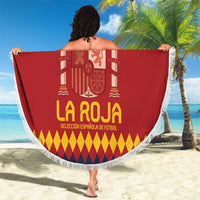 Red round La Roja beach blanket with white fringe border, crest, and 'YOUR TEXT'.