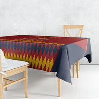 Red Spain football tablecloth with yellow and navy diamond pattern, draped corners