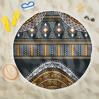 Round beach blanket with tribal geometric pattern and gold accents, white fringe edge