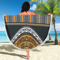 Round beach blanket with striped tribal band and medallion design, gold accents, fringe