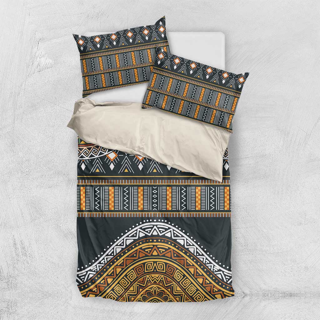 Charcoal bedding set with gold and green tribal patterns; duvet and two pillowcases.