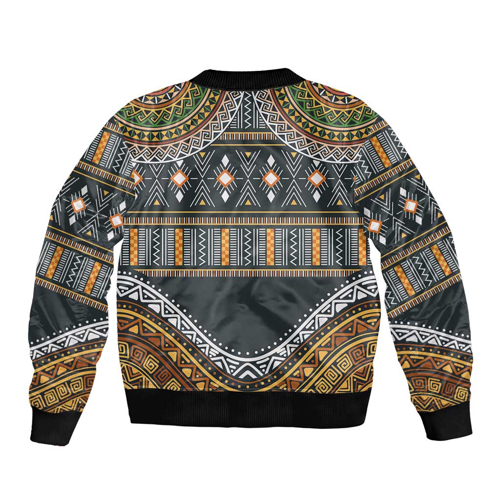 Unisex bomber jacket with ribbed hem and large tribal geometric back graphic.