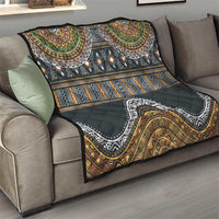 Ethnic throw quilt on sofa, black with gold, green and orange tribal patterns