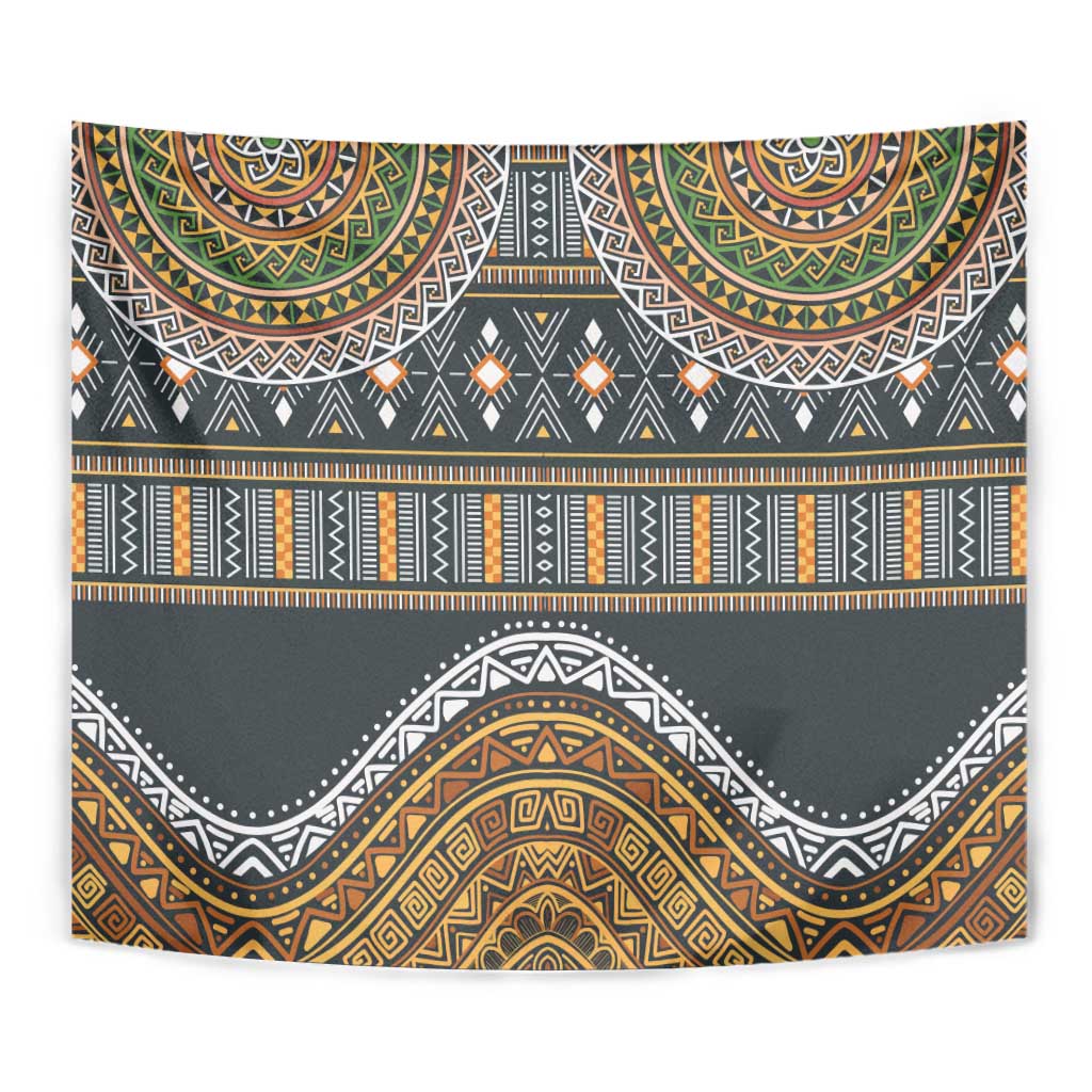 Close-up wall tapestry showing dark gray fabric with gold, orange, green patterned bands