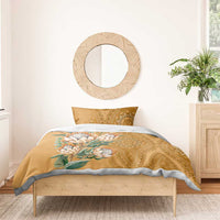 Gold duvet with protea bouquet print and paisley-style ornate pattern, with matching pillow