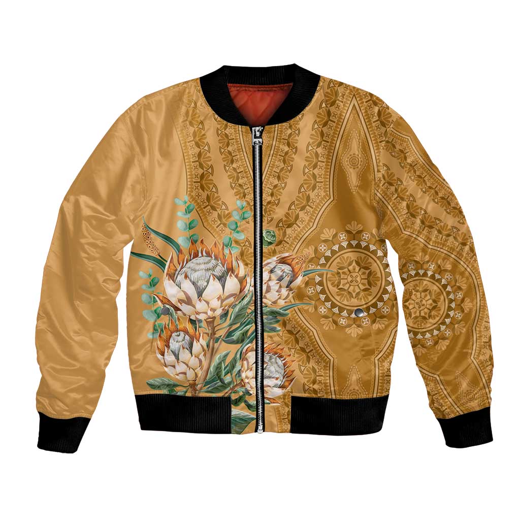 Gold unisex bomber jacket with zip front, black ribbed hem, and protea motif panel