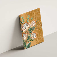 Gold protea canvas wall art on wall with green leaves and decorative ornamental shapes
