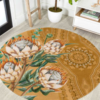 Round gold carpet with dashiki floral proteas motif and ornate center medallion