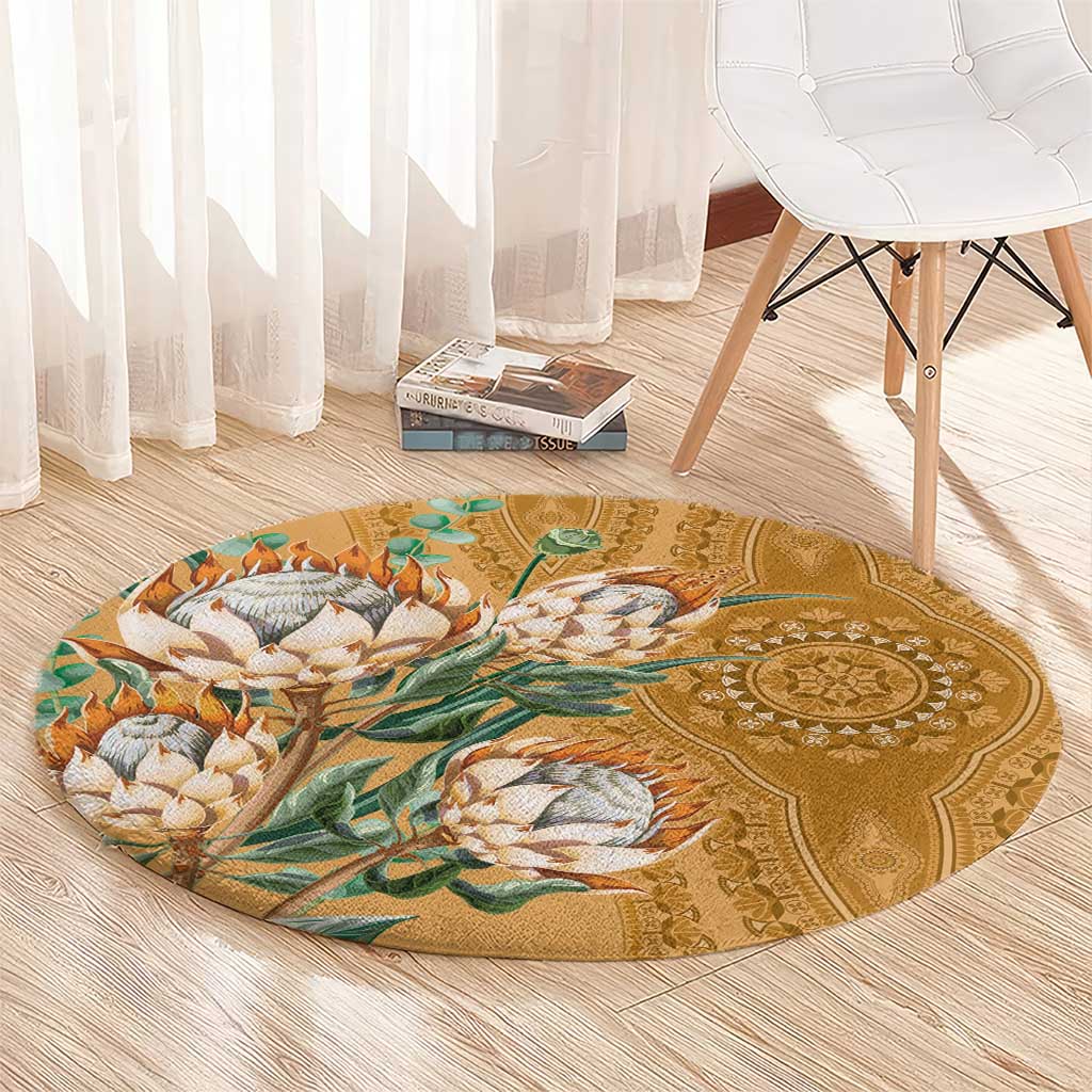 Round gold circular carpet with proteas and leafy vine print, decorative medallion band