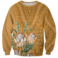 Gold crewneck sweatshirt with dashiki tribal motif and flower-and-leaf graphic